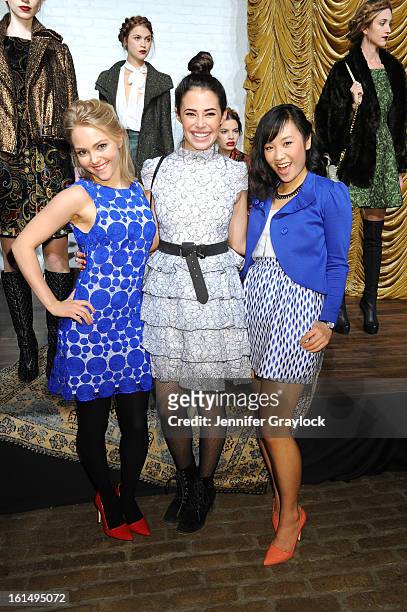 Actors AnnaSophie Robb, Chloe Bridges, Ellen Wong pose at the Alice + Olivia By Stacey Bendet Fall 2013 fashion show presentation during...