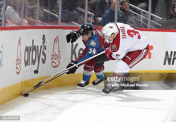David Jones of the Colorado Avalanche skates against Keith Yandle of the Phoenix Coyotes at the Pepsi Center on February 11, 2013 in Denver, Colorado.