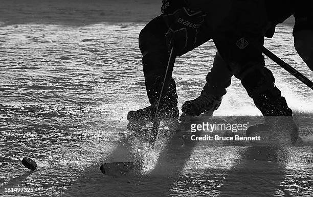 Closeup of a puck on the pond in the 2013 USA Hockey Pond Hockey National Championships on February 8, 2013 in Eagle River, Wisconsin. The three-day...
