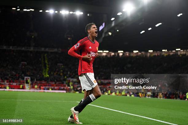 Raphael Varane of Manchester United celebrates after scoring the team's first goal during the Premier League match between Manchester United and...