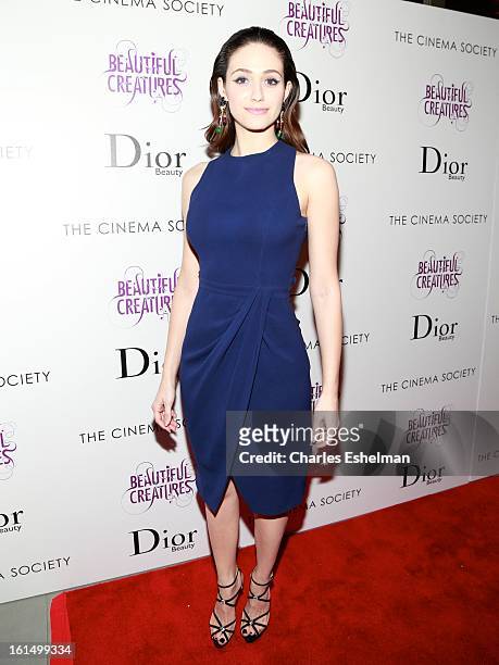 Actress Emmy Rossum arrives at The Cinema Society And Dior Beauty host a screening of "Beautiful Creatures" at Tribeca Cinemas on February 11, 2013...