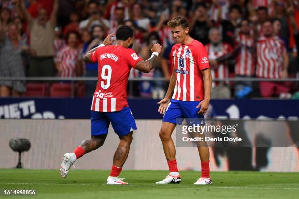 Marcos Llorente of Atletico Madrid celebrates after scoring the team's third goal during the LaLiga EA Sports match between Atletico Madrid and...