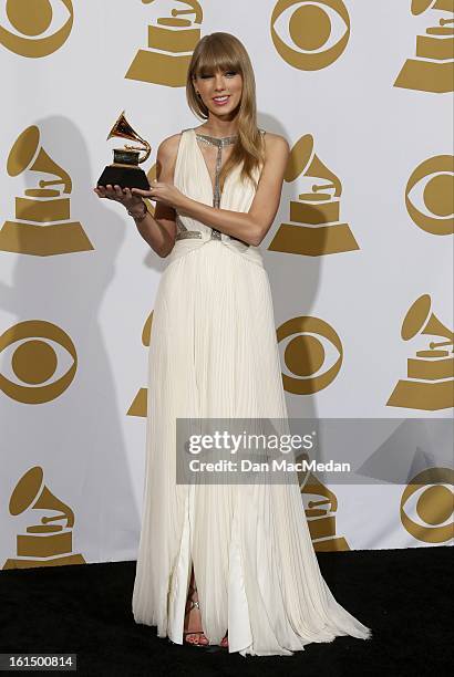 Singer/Musician Taylor Swift, winner of Best Song Written For Visual Media, poses in the press room at the 55th Annual Grammy Awards at the Staples...