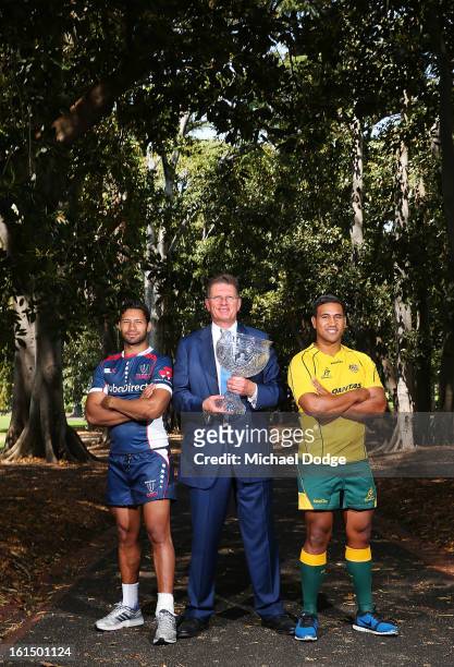 Kimani Situati of the Melbourne Rebels , the Premier of Victoria Ted BaIllieu and Cooper Vuna of the Wallabies pose during a photocall with the Tom...