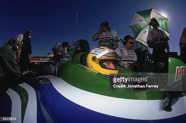 Mario Dominguez of Mexico who drives a Ford Lola for Herdez Competition sits in a pit stop during the CART Spring Testing at Laguna Seca Raceway in...