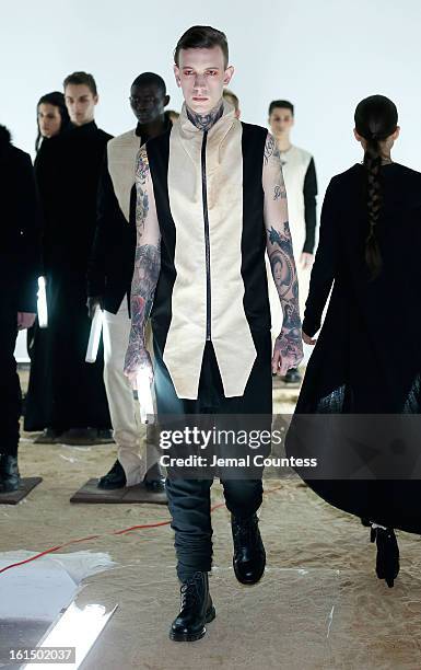 Model walks the runway at the Odd fall 2013 presentation during Mercedes-Benz Fashion Week at Industria Superstudio on February 11, 2013 in New York...