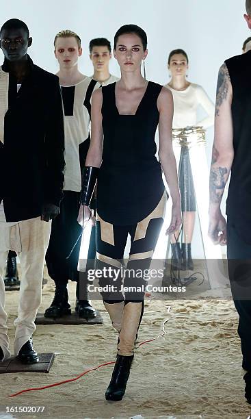Model walks the runway at the Odd fall 2013 presentation during Mercedes-Benz Fashion Week at Industria Superstudio on February 11, 2013 in New York...