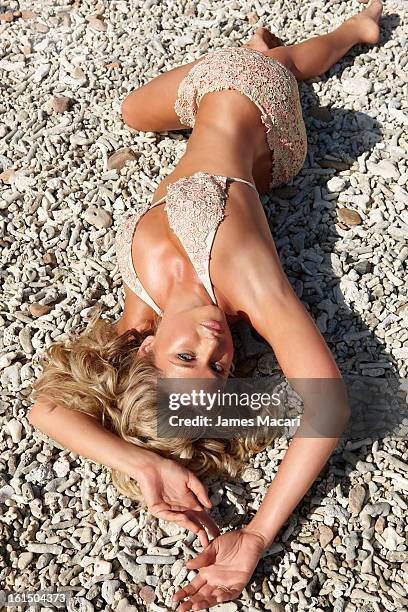 Swimsuit Issue 2013: Model Genevieve Morton poses for the 2013 Sports Illustrated Swimsuit issue on May 11, 2012 in Hayman Island, Australia....