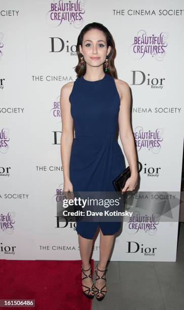 Emmy Rossum attends The Cinema Society And Dior Beauty Presents A Screening Of "Beautiful Creatures" at Tribeca Cinemas on February 11, 2013 in New...