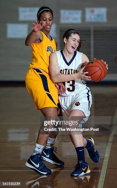 Visitation's Sarah Tierney gets past Bullis' Kirby Porter Monday, February 11, 2013 in Washington, DC. Visitation beat visiting Bullis 75-58.