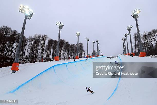 Athletes take part in an open training session on the Snowboard Half Pipe in the Extreme Park up at the Rosa Khutor Alpine Ski Resort on February 12,...