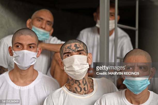 Inmates remain inside a cell at the Counter-Terrorism Confinement Centre mega-prison, where hundreds of members of the MS-13 and 18 Street gangs are...