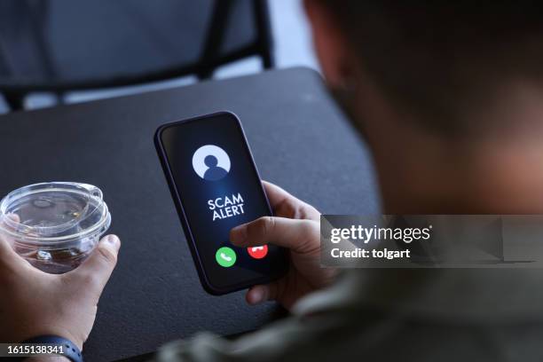 scam alert on mobile phone screen - unknown number call stock pictures, royalty-free photos & images