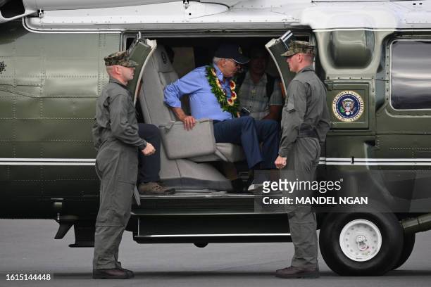 President Joe Biden prepares to step off Marine One before boarding Air Force One to depart Kahului Airport in Kahului, Hawaii, on August 21, 2023....