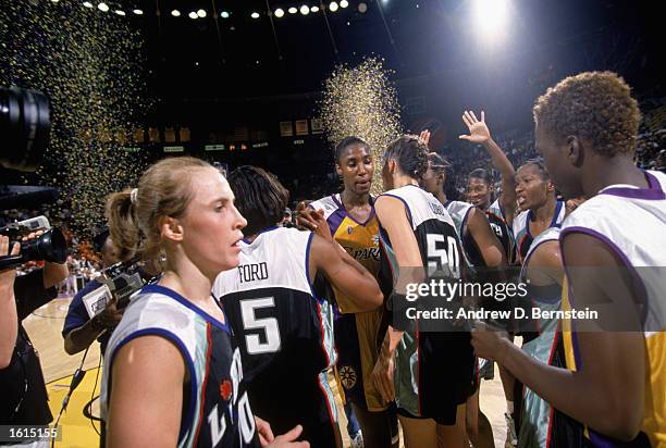 Lisa Leslie of the Los Angeles Sparks congratulates Rebecca Lobo of the New York Liberty after the inaugural WNBA game at the Great Western Forum on...