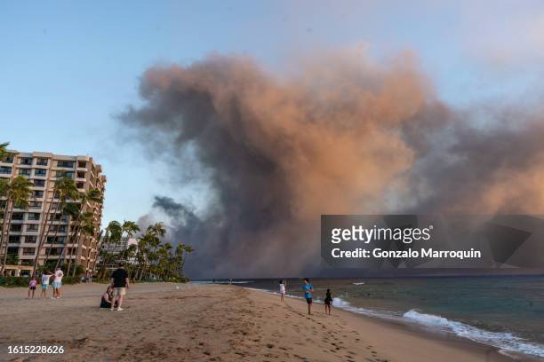 Wildfires burn over the town of Lahaina as seen in the neighboring Kaanapali Alii resort, on August 08, 2023 in Kaanapali, Maui, Hawaii
