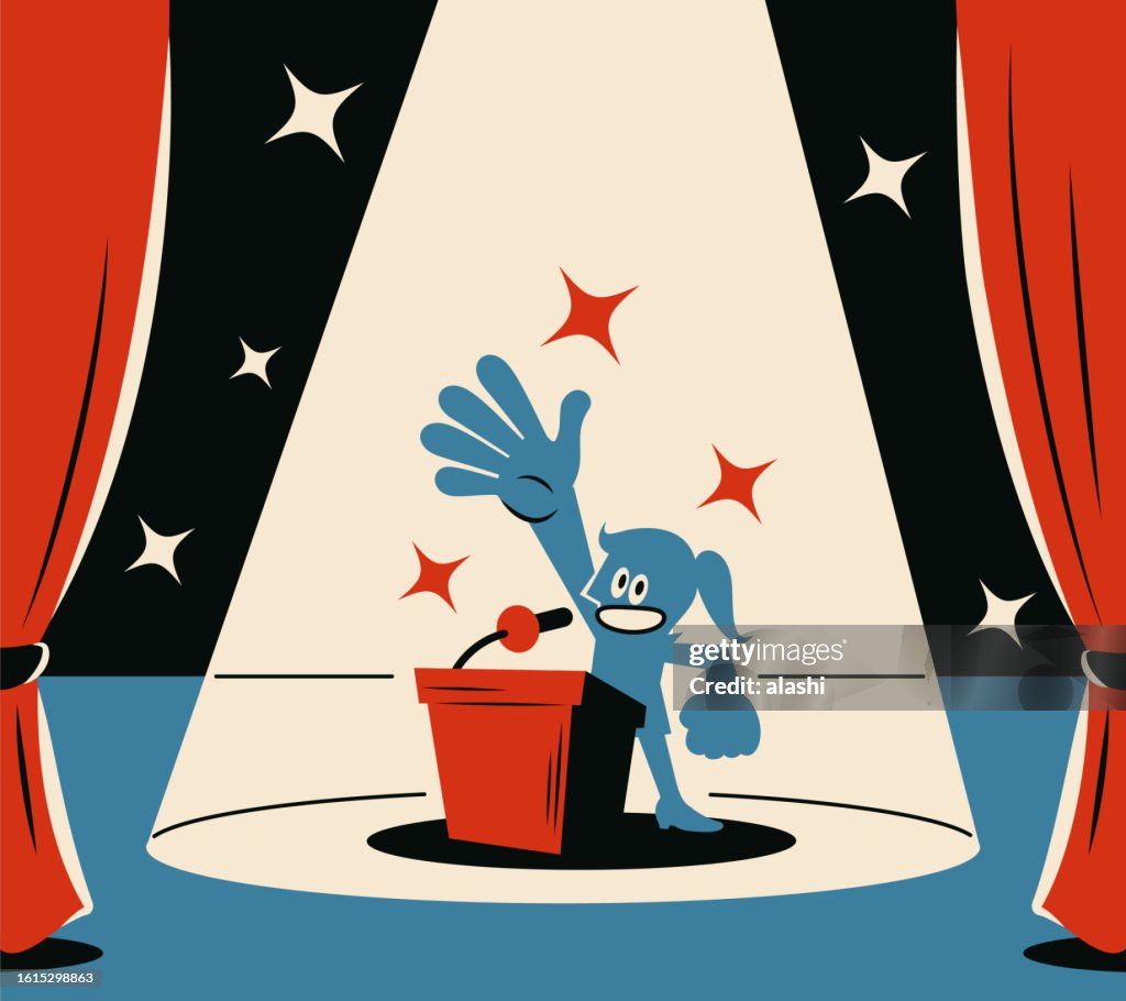 A confident woman giving a speech on a podium on stage