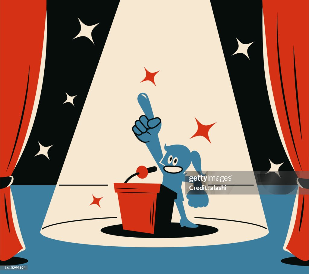 A confident woman giving a speech on a podium on stage, pointing her index finger upwards