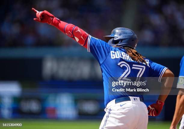 Vladimir Guerrero Jr. #27 of Toronto Blue Jays celebrates a RBI single against the Chicago Cubs during the fourth inning in their MLB game at the...