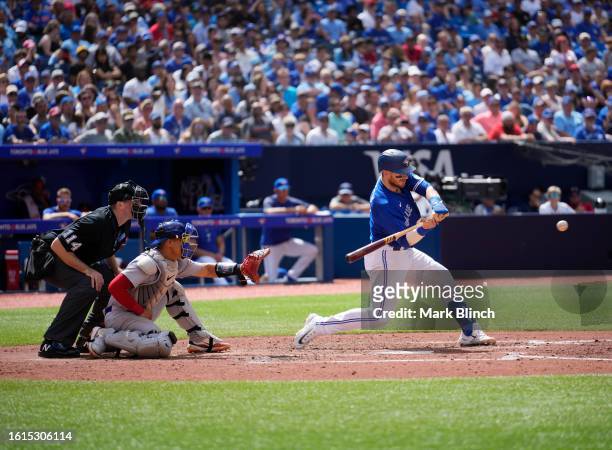 Danny Jansen of Toronto Blue Jays takes an at bat against the Chicago Cubs during the fourth inning in their MLB game at the Rogers Centre on August...