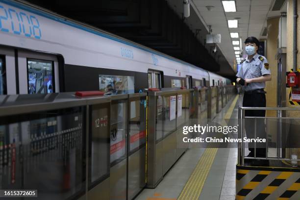 Passengers ride a time-themed subway train of Beijing Subway Line 1, marking the first immersive "time-traveling" experience on a subway train on...