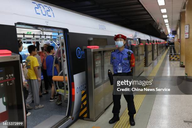 Passengers ride a time-themed subway train of Beijing Subway Line 1, marking the first immersive "time-traveling" experience on a subway train on...