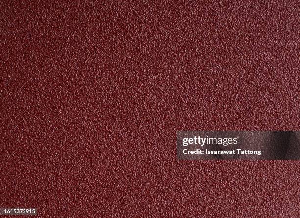 texture of red sandpaper.rough sandpaper background. - red slip bildbanksfoton och bilder