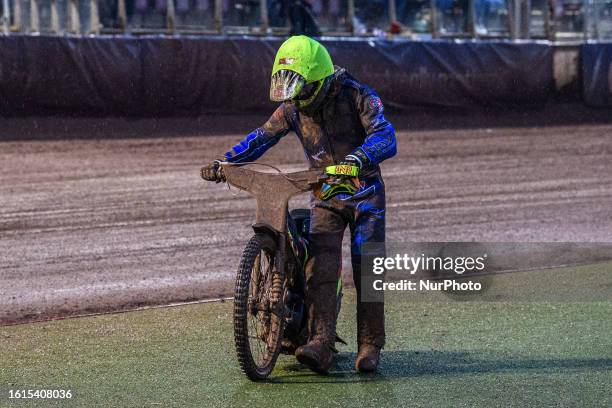 Michael Palm Toft pushes his bike back after his has an engine failure during the Sports Insure Premiership match between Belle Vue Aces and King's...