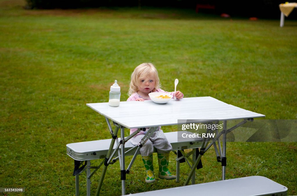 Child at camping table