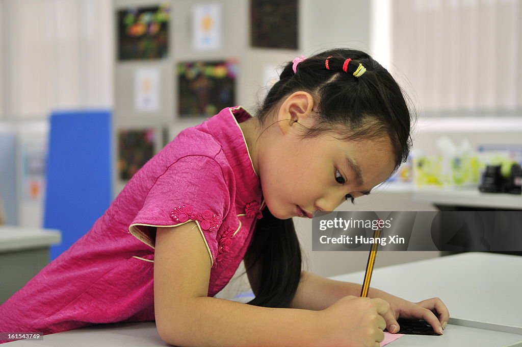 Girl Writing in Primary School