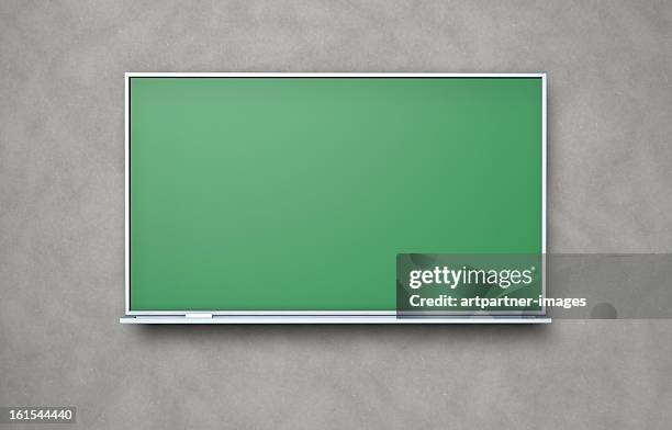 blank blackboard with chalk on a concrete wall - bâton de craie photos et images de collection