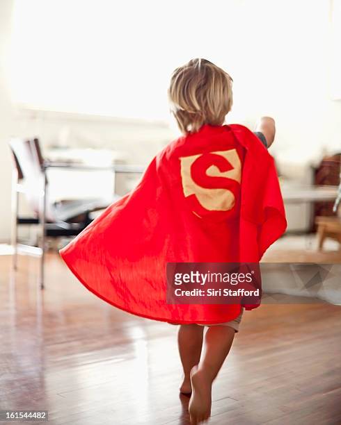 young boy with homemade cape - boy barefoot rear view stock-fotos und bilder