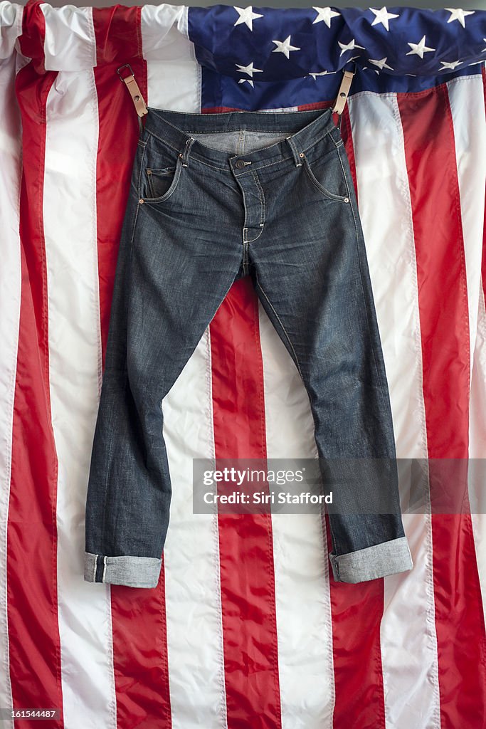 Jeans hanging in front of the American flag