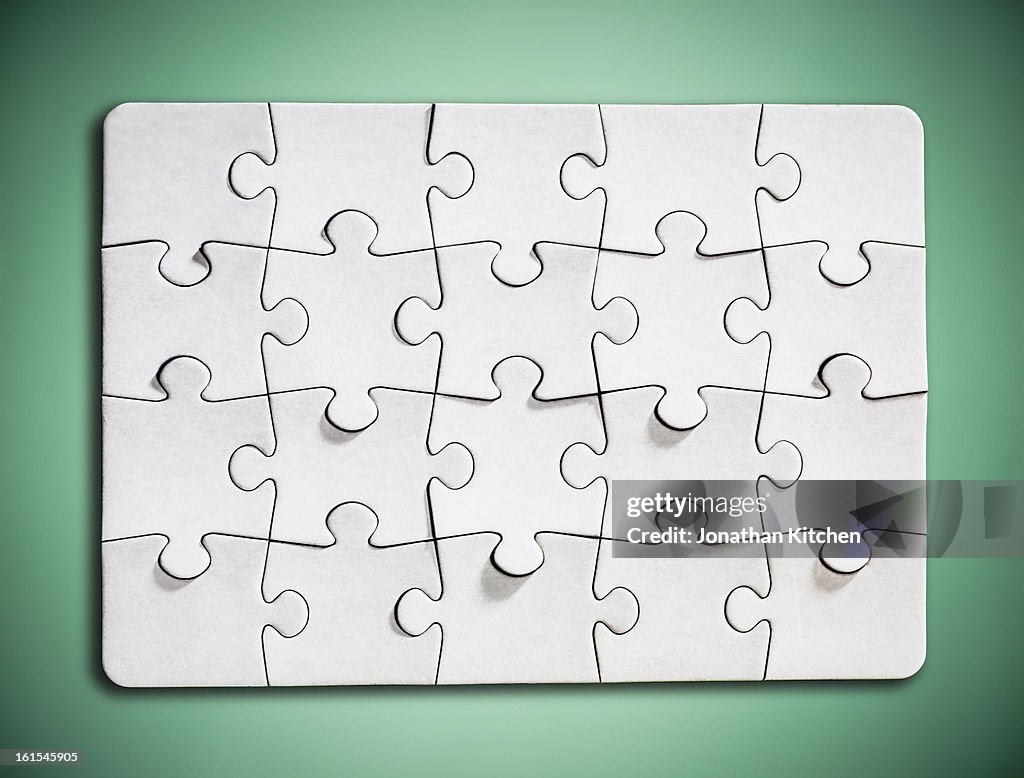 White Jigsaw puzzle on green