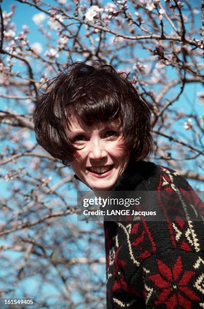 Sabine Azema On Holiday In Camargue. Sabine AZEMA en vacances en Camargue L'actrice pose en pull-over cheveux au vent et dans la figure sous un arbre...