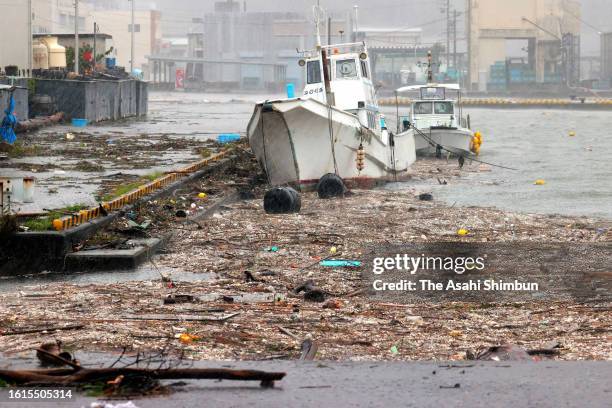 Driftwoods and rubbish are scattered at Owase Port as Typhoon Lan makes a landfall on August 15, 2023 in Owase, Mie, Japan. The Typhoon halt parts of...