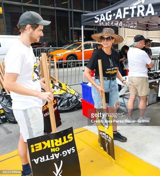 Roman Walker Zelman and Debra Messing are seen at the SAG-AFTRA picket line in Downtown, Manhattan on August 21, 2023 in New York City.