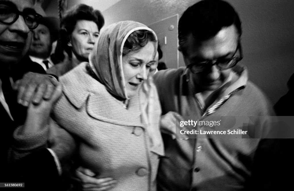 Earl Ruby Crowded by police and members of the press, Eva Grant and Earl Ruby ...