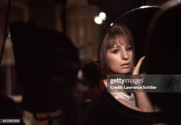 American singer and actress Barbra Streisand sits in front of her makeup mirror during the filming the motion picture, 'On a Clear Day You Can See...