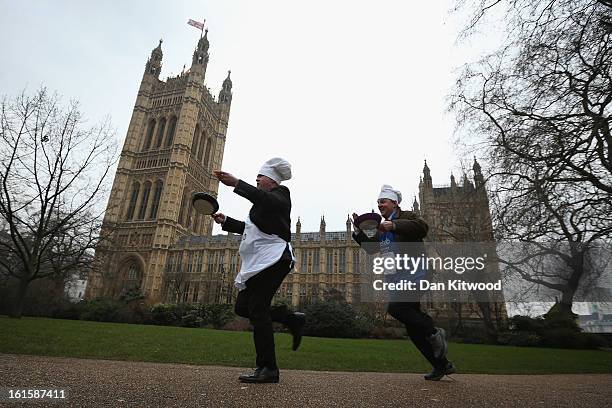 The annual Parliamentary Pancake Race takes place in front of the Houses of Parliament on Shrove Tuesday on February 12, 2013 in London, England. Now...