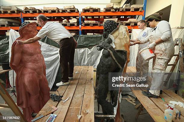 Artisans prepare casting moulds on original sculptures at the Schlossbauhuette studio where a team of sculptors is creating decorative elements for...