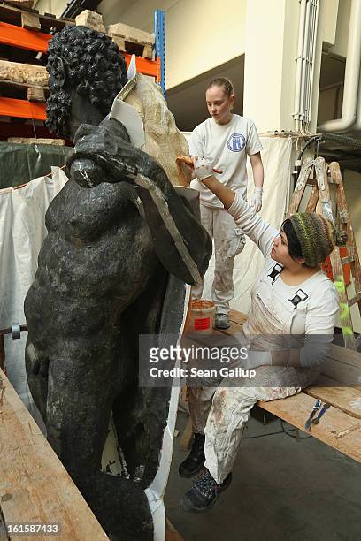 Artisans prepare casting moulds on an original sculpture of Herkules at the Schlossbauhuette studio where a team of sculptors is creating decorative...