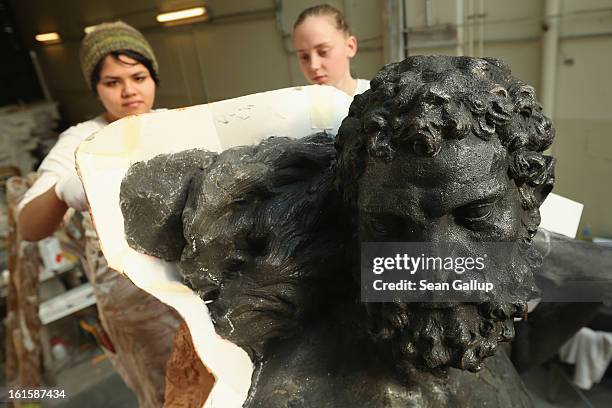 Artisans prepare casting moulds on an original sculpture of Herkules at the Schlossbauhuette studio where a team of sculptors is creating decorative...