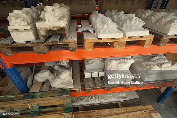 Plaster cast details that a scultor will use to copy into stone lie on shelves at the Schlossbauhuette studio where a team of sculptors is creating...