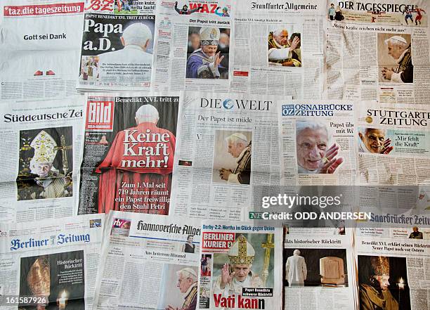 Picture shows German newspapers covering the resignation of Pope Benedict on their front pages on February 12, 2013. The pope's brother said on...