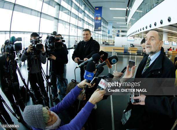 Deputy Director General and Head of the Department of Safeguards Herman Nackaerts talks with journalists as he leaves for another trip with his team...