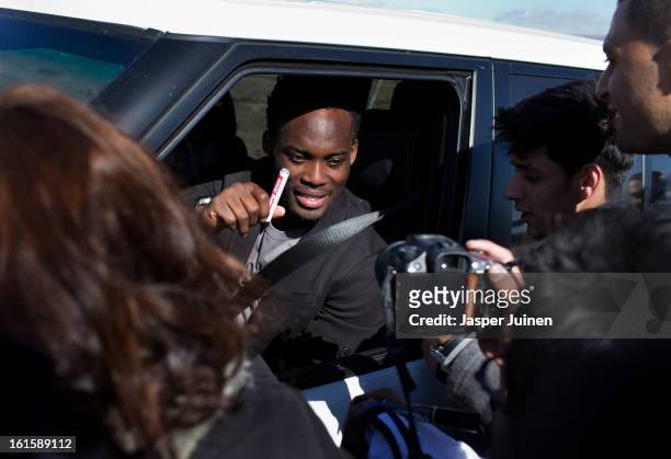 Michael Essien of Real Madrid signs autographs to fans waiting outside the Real Madrid training ground after a training session ahead of the UEFA...