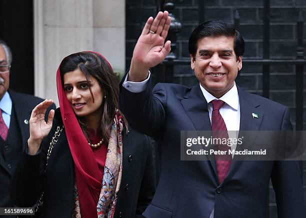 Prime Minister Raja Pervez Ashraf of Pakistan waves to reporters as he leaves 10 Downing Street with Pakistani Foreign Minister Hina Rabbani Khar...