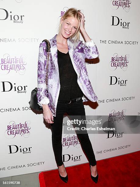 Model Caroline Weinberg arrives at The Cinema Society And Dior Beauty host a screening of "Beautiful Creatures" at Tribeca Cinemas on February 11,...