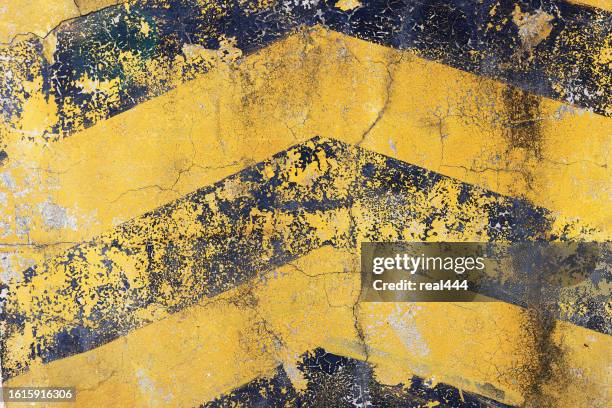 grunge yellow and black diagonal stripes - dirty yellow stock pictures, royalty-free photos & images